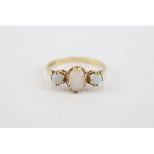 45 - 9ct gold opal three stone ring (1.8g) Size  M