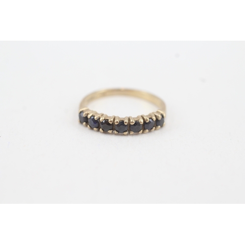 90 - 9ct gold sapphire seven stone ring (1.6g) Size  K 1/2