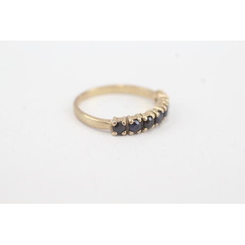 90 - 9ct gold sapphire seven stone ring (1.6g) Size  K 1/2