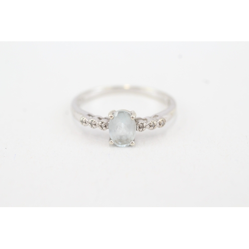 91 - 9ct white gold aquamarine single stone ring with diamond set shoulders (1.9g) Size  Q