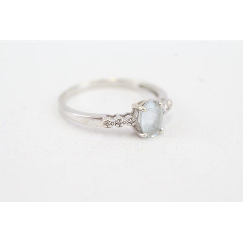 91 - 9ct white gold aquamarine single stone ring with diamond set shoulders (1.9g) Size  Q