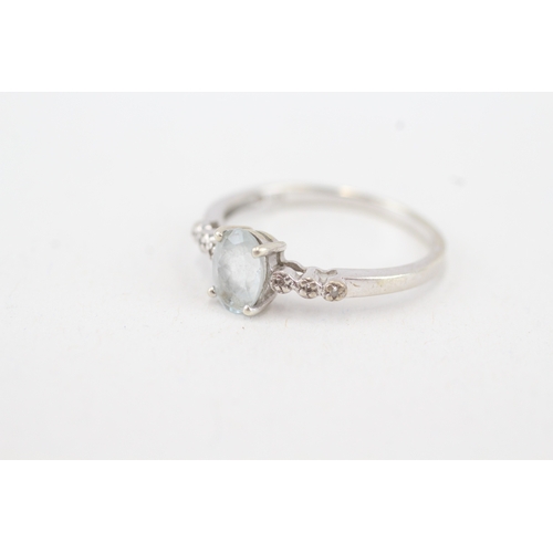 91 - 9ct white gold aquamarine single stone ring with diamond set shoulders (1.9g) Size  Q