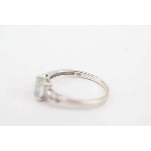 91 - 9ct white gold aquamarine single stone ring with diamond set shoulders (1.9g) Size  Q