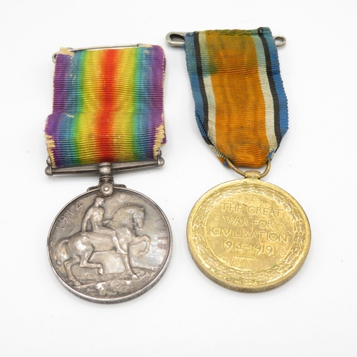 404 - WWI medal pair named 265715 Pte. G. Lomas Cheshire Regt.