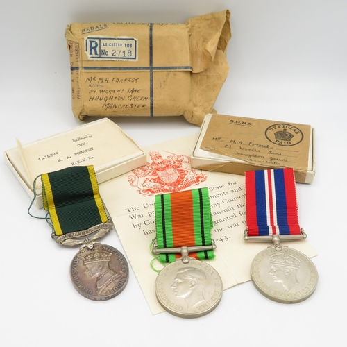 412 - WWII Territorial boxed medal group and postal packet.  Territorial named 1474920 CFN M.A. Forrest R.... 