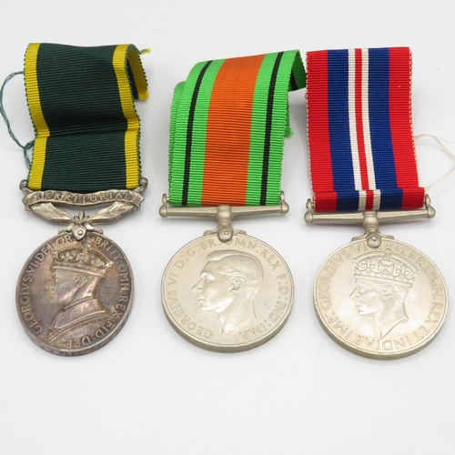 412 - WWII Territorial boxed medal group and postal packet.  Territorial named 1474920 CFN M.A. Forrest R.... 