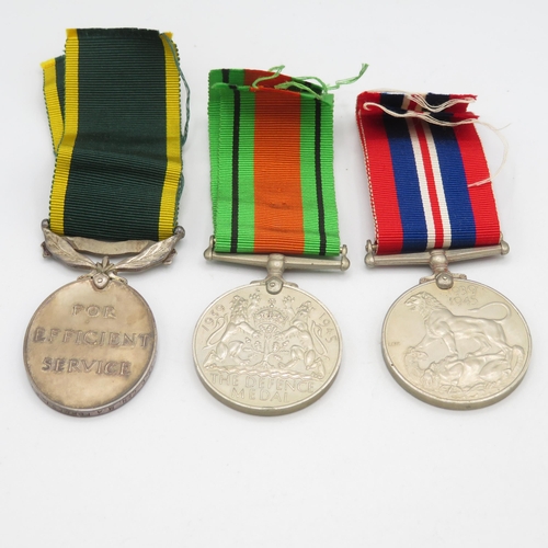 412 - WWII Territorial boxed medal group and postal packet.  Territorial named 1474920 CFN M.A. Forrest R.... 