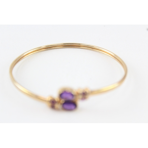 10 - 9ct gold amethyst bypass bangle (7.7g)