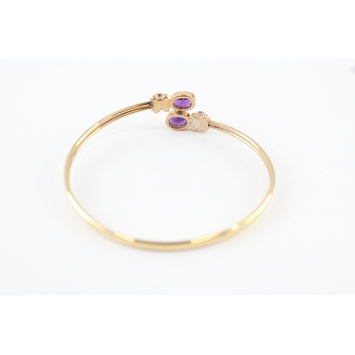 10 - 9ct gold amethyst bypass bangle (7.7g)