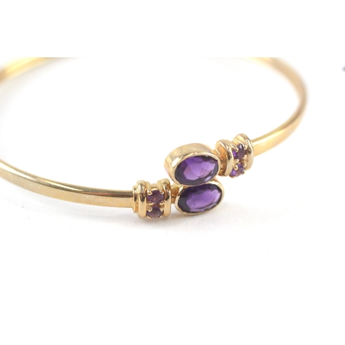 10 - 9ct gold amethyst bypass bangle (7.7g)