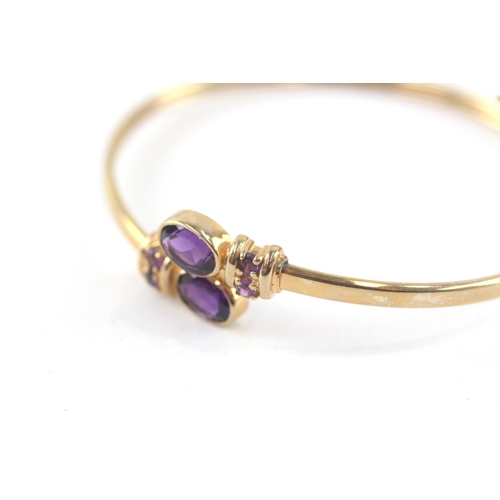 10 - 9ct gold amethyst bypass bangle (7.7g)