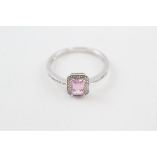 119 - 9ct gold pink gemstone & diamond halo ring (2.1g) Size  R