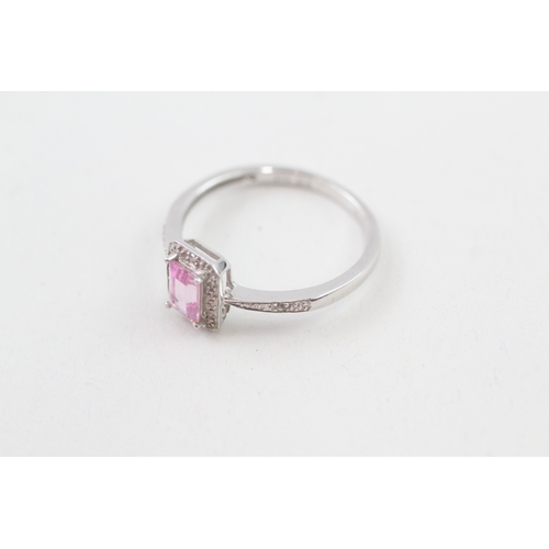 119 - 9ct gold pink gemstone & diamond halo ring (2.1g) Size  R