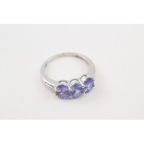 124 - 9ct gold oval cut tanzanite & diamond dress ring (2.5g) Size  N 1/2