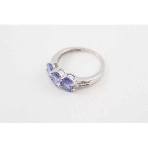 124 - 9ct gold oval cut tanzanite & diamond dress ring (2.5g) Size  N 1/2