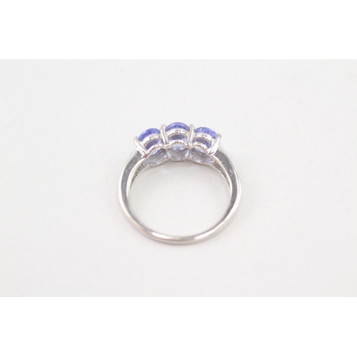 124 - 9ct gold oval cut tanzanite & diamond dress ring (2.5g) Size  N 1/2