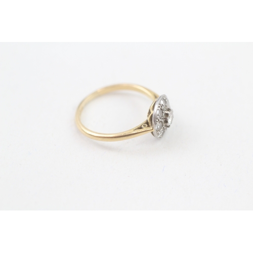 243 - 18ct gold diamond halo ring (2.4g) Size  L