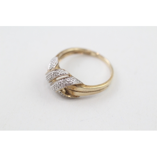 257 - 9ct gold diamond knot ring (2.2g) Size  P