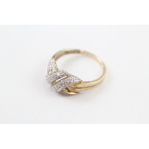 257 - 9ct gold diamond knot ring (2.2g) Size  P