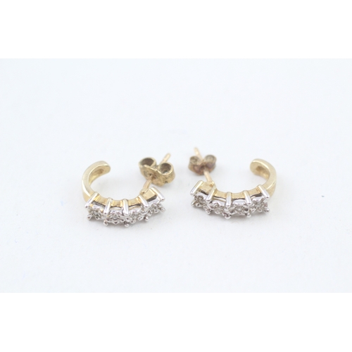 270 - 9ct gold diamond four stone half hoop earrings (2.5g)