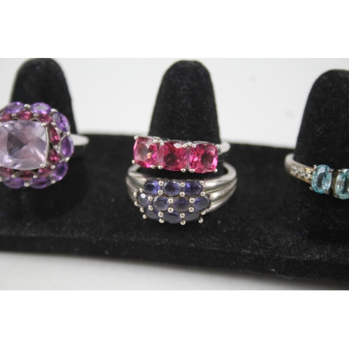 307 - A collection of silver gemstone rings including Diamond (32g)