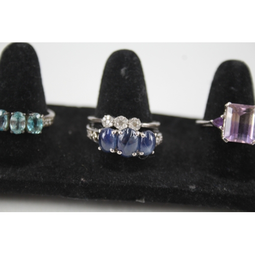 307 - A collection of silver gemstone rings including Diamond (32g)