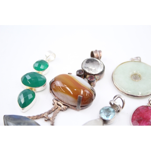 309 - A collection of silver gemstone pendants including boulder Opal (82g)