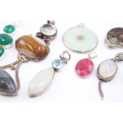 309 - A collection of silver gemstone pendants including boulder Opal (82g)