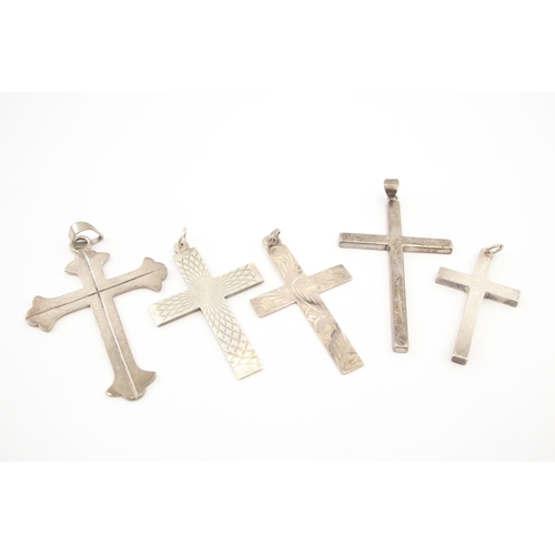 312 - Five silver cross pendants including etched (44g)