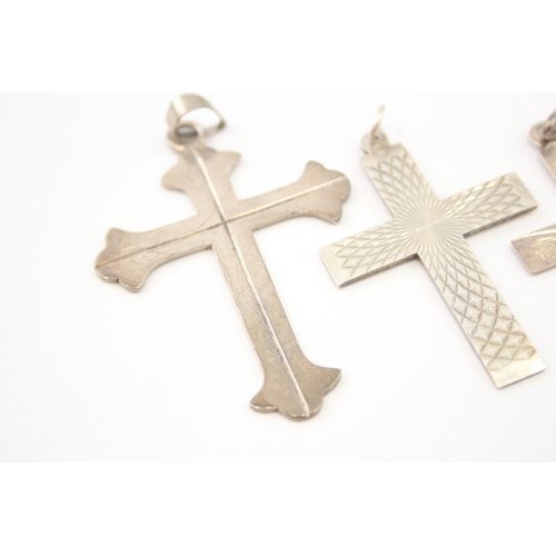 312 - Five silver cross pendants including etched (44g)