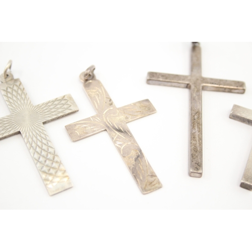 312 - Five silver cross pendants including etched (44g)