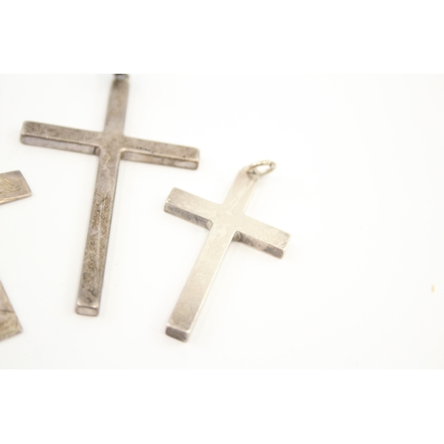 312 - Five silver cross pendants including etched (44g)