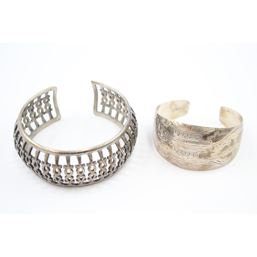 324 - Two silver cuff bangles including Egyptian hallmarks (57g)