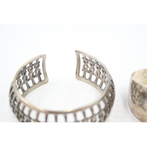 324 - Two silver cuff bangles including Egyptian hallmarks (57g)