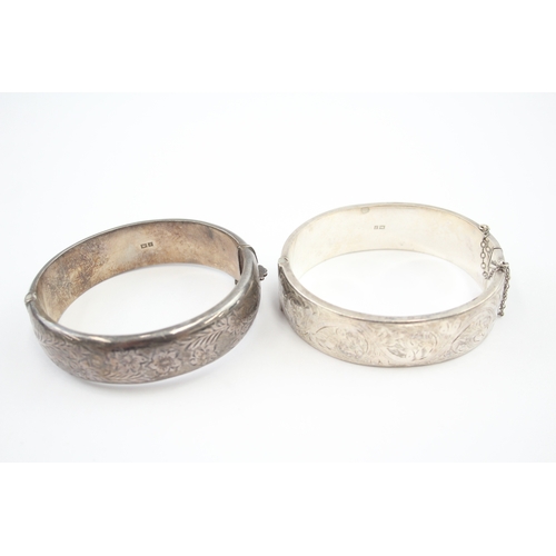 325 - Two silver bangles with etched designs (58g)