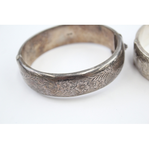 325 - Two silver bangles with etched designs (58g)