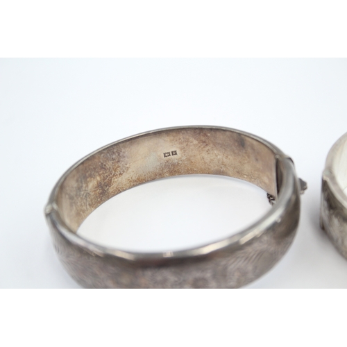 325 - Two silver bangles with etched designs (58g)