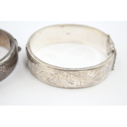 325 - Two silver bangles with etched designs (58g)