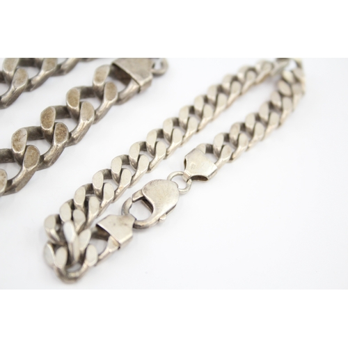 327 - Three silver chain bracelets including curb and figaro link (119g)