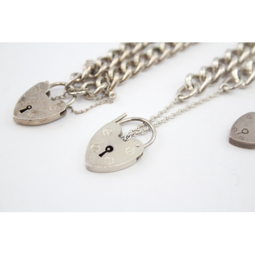 329 - Three silver curb bracelets with heart padlock clasps (71g)