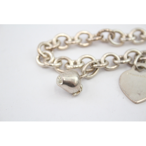 333 - Silver bracelet with heart tag and apple charm by designer Tiffany & Co (42g)