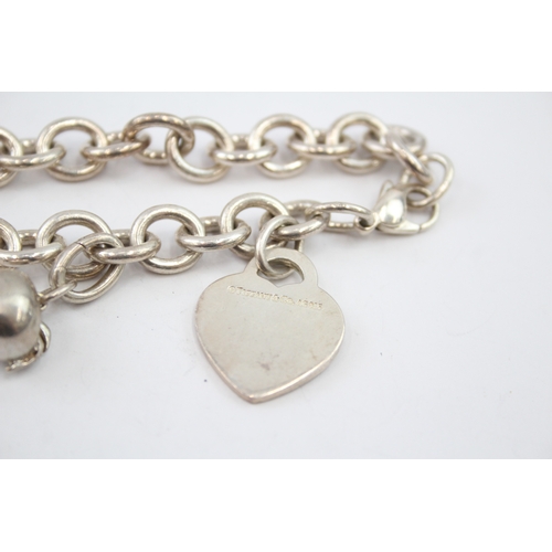 333 - Silver bracelet with heart tag and apple charm by designer Tiffany & Co (42g)