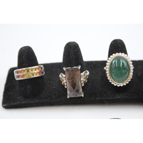 335 - A collection of silver gemstone rings including Opal (40g)