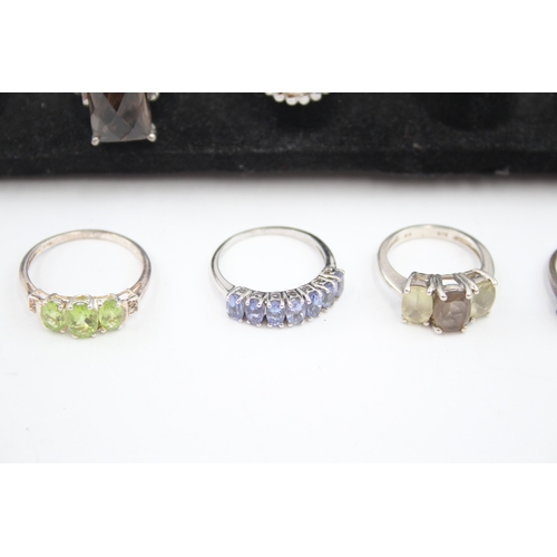 335 - A collection of silver gemstone rings including Opal (40g)