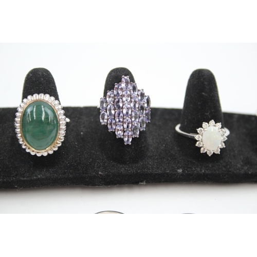 335 - A collection of silver gemstone rings including Opal (40g)