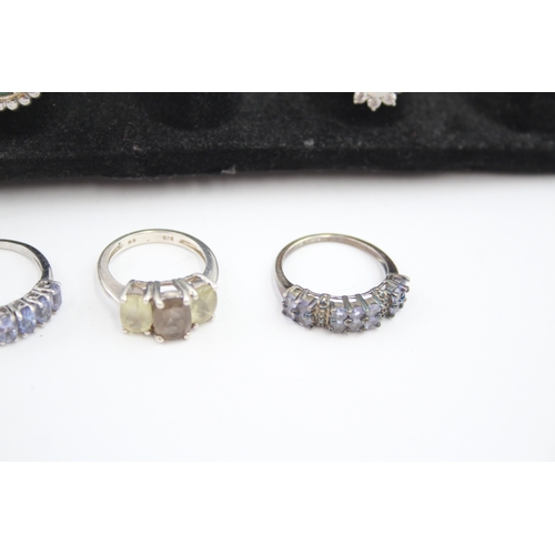 335 - A collection of silver gemstone rings including Opal (40g)