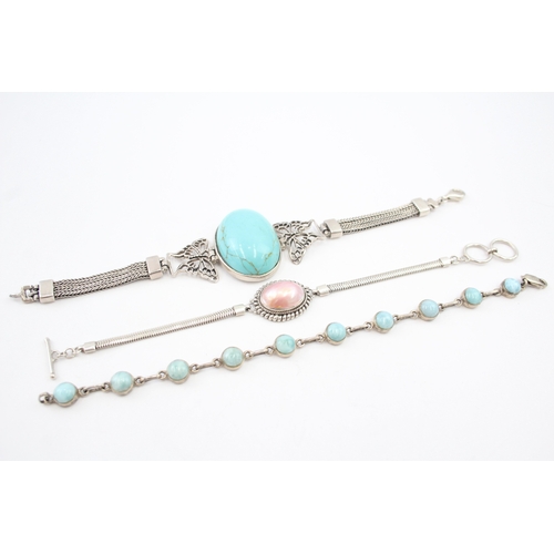 336 - Three silver gemstone bracelets including Larimar (55g)