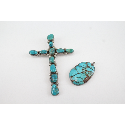 338 - Two silver Native American Turquoise pendants including cross (32g)