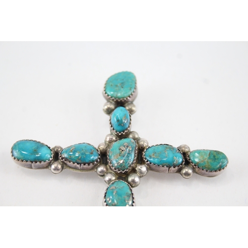 338 - Two silver Native American Turquoise pendants including cross (32g)