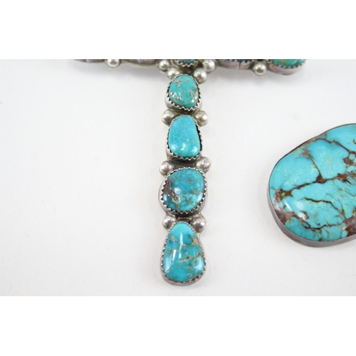 338 - Two silver Native American Turquoise pendants including cross (32g)